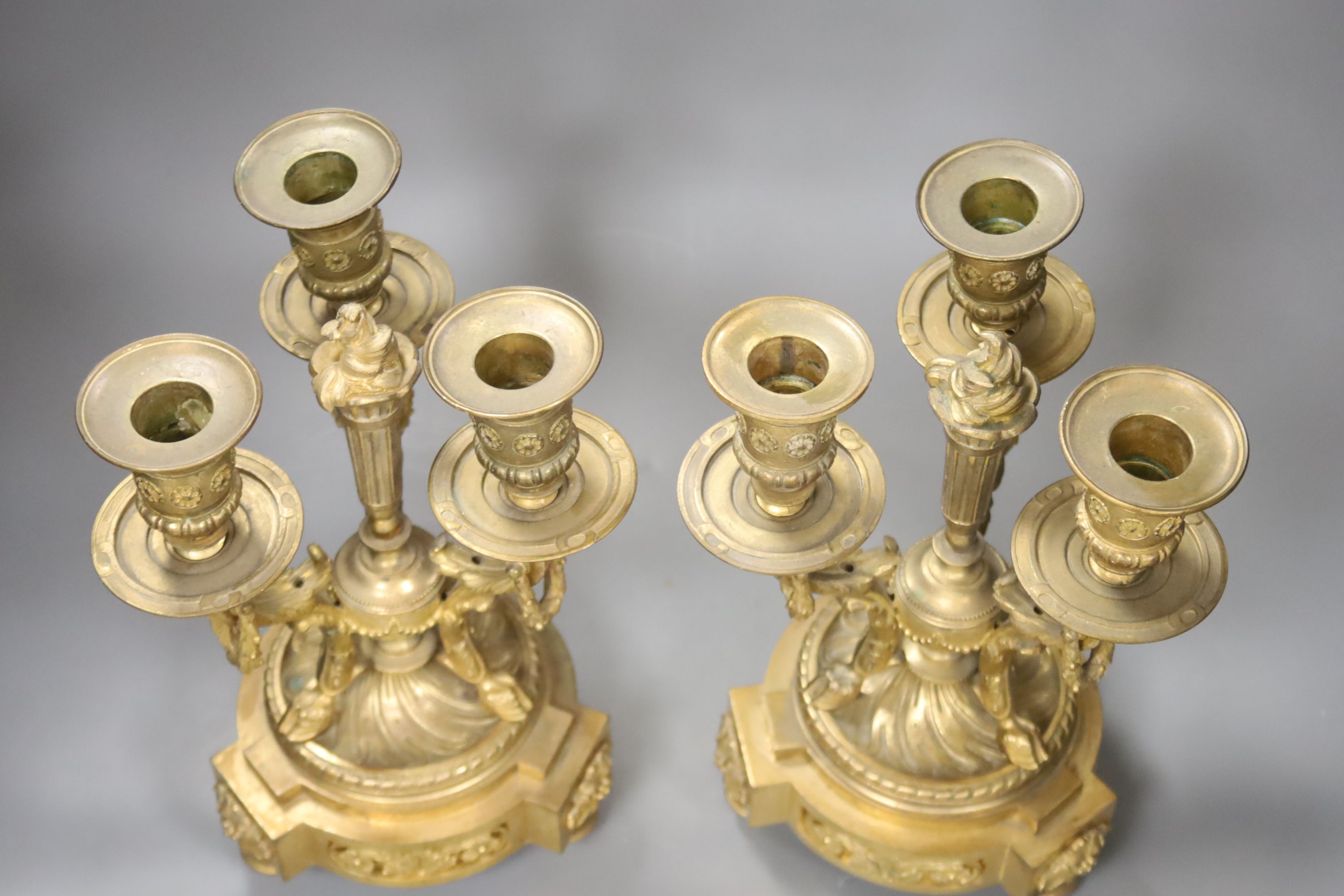 A pair of ormolu three branch candelabra